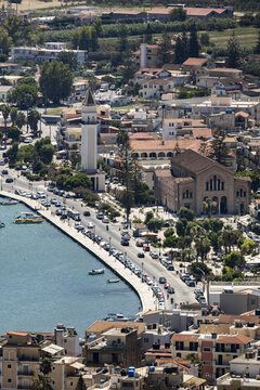 Aerial view of the Agios Dionysios Church and its bell tower along the waterfront in Zakinthos, Greece.