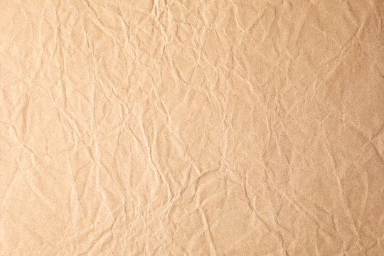 Old brown kraft crumpled paper texture
