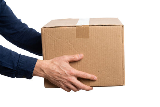 Man holding brown cardboard package secured with tape