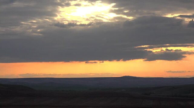 Red sun dusk above Chad cloud layers fiery evening glow evening weather detail.