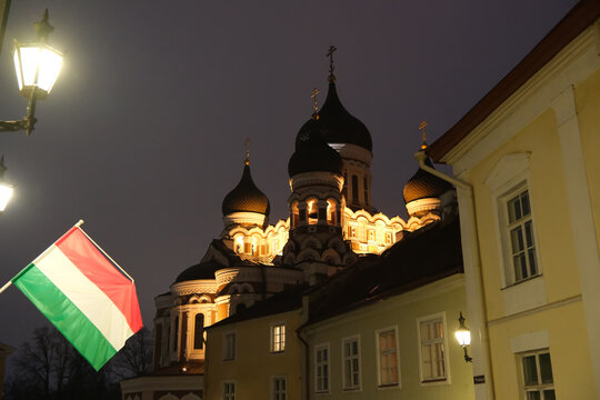 Night view of Alexander Nevsky Cathedral in Tallinn, Estonia, with Hungarian flag 
