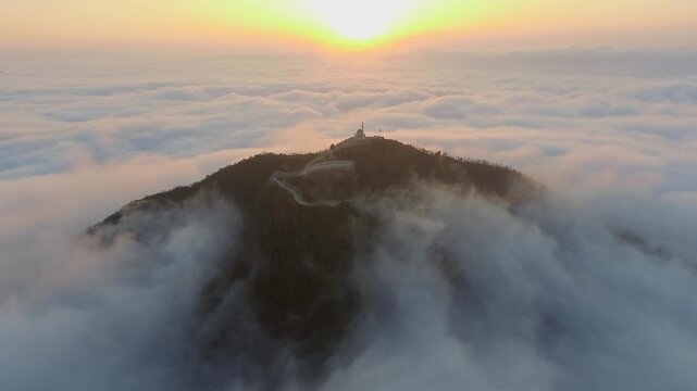 Mosque above clouds in Rize Turkey stands on mountain peak with minaret spiritual atmosphere.