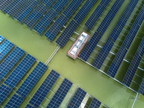 Aerial view of the Sirajganj 68MW Solar Park featuring rows of floating solar panels on water in Sirajganj, Rajshahi Division, Bangladesh.