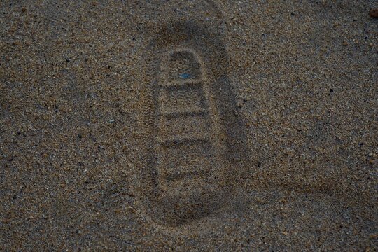 Human Footprint Imprint on Sandy Ground
