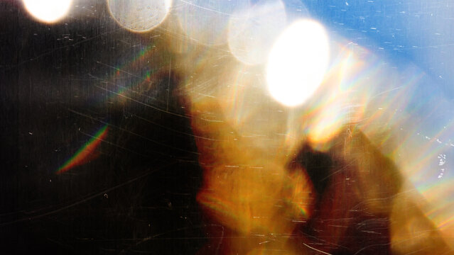 light leak overlay effect with scratch dust and blur light leaks, retro grain noisy film distressed texture light leak flare on black background, grunge dirty distressed blurry light background