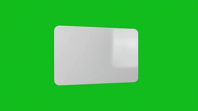 3D blank plastic gift card rotating slowly on a bright green screen background for chroma key compositing