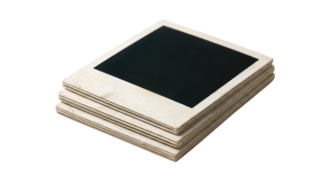 Stack of blank instant photo prints with black placeholder space isolated on white background