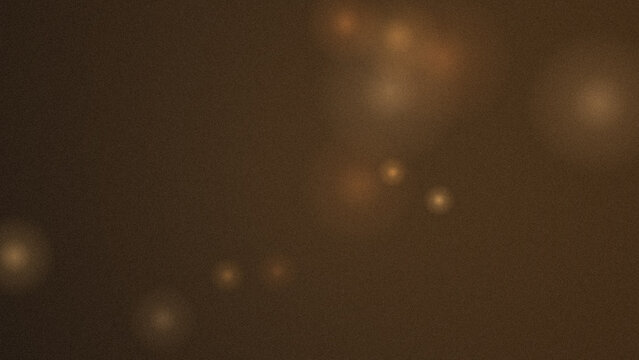 Abstract background, featuring soft golden, light orbs and, glowing particles on, a dark brown surface