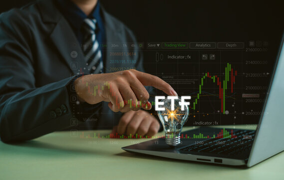 ETF investment concept showing a professional analyzing financial markets on a laptop, with trading charts, candlestick data, market trends and digital tools for strategic investing.