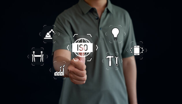 Quality management and business standards concept with professional worker using digital interface, highlighting innovation, technology, industry, compliance, efficiency, and excellence.