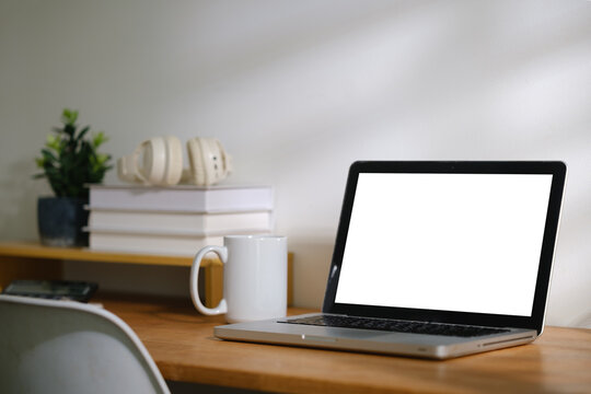 Blank computer screen displayed on a modern workspace desk for a digital mockup.