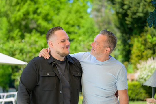 Father Watching Adult Son Proudly