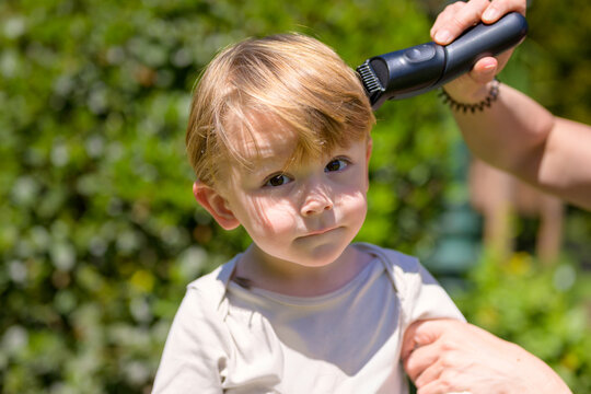 Toddler Getting Haircut Outside Naturally