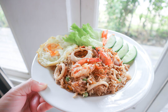 fried rice or stir-fried rice with shrimp , squid and fried egg or sunny side up egg