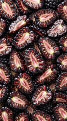 Obraz premium Close up top view of sliced fresh blackberries forming a textured background
