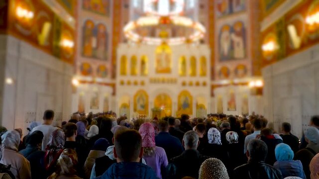 Congregation in an ornate church interior.