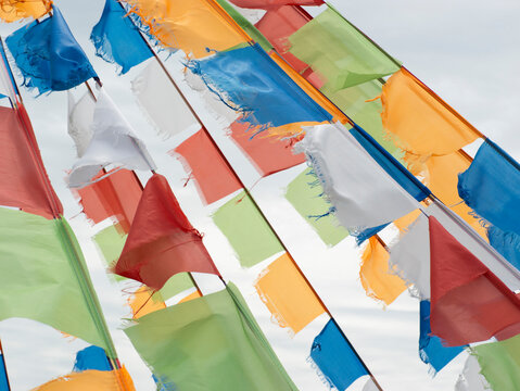 Colorful prayer flags fluttering in wind on Inner Mongolia grassland