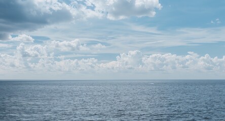 Obraz premium Seascape, horizon and clouds with copy space on left, featuring Ocean and Water, with Scenic, as a contemporary creative concept, for editorial and marketing use, for commercial use, for editorial use