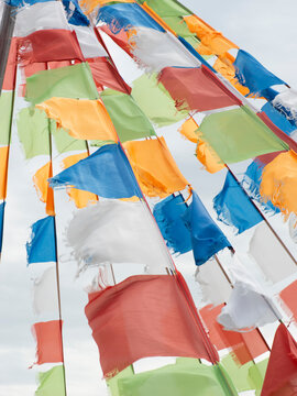Colorful prayer flags fluttering in wind on Inner Mongolia grassland