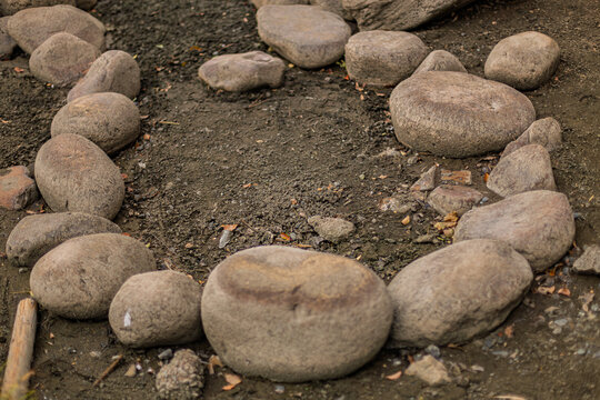Circular arrangement of rounded stones showcasing ground texture at Kiyosumi Gardens March 2024