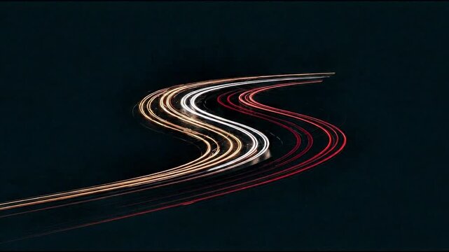 Video: time-lapse of a highway with a black background and vehicle headlights 