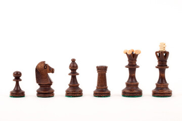 Brown wooden chess pieces © Janusz
