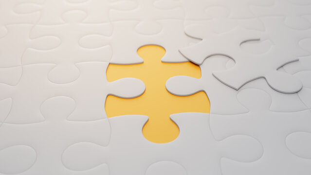 Close up of Yellow and White Jigsaw Puzzle Backdrop focusing on the last piece to go into place. Final Step Concept.