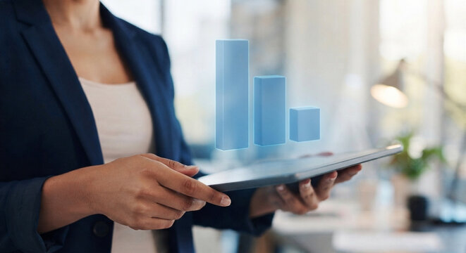 Photo, close-up, an employee's hand holding a tablet and displaying a bar chart icon 
