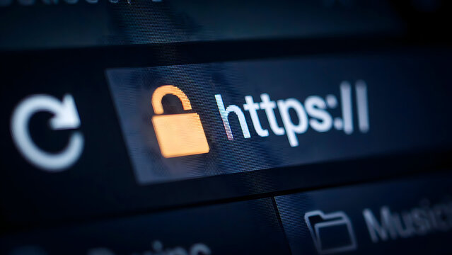 A close-up view of a web browser address bar displaying a secure https protocol with a glowing orange padlock indicating website safety