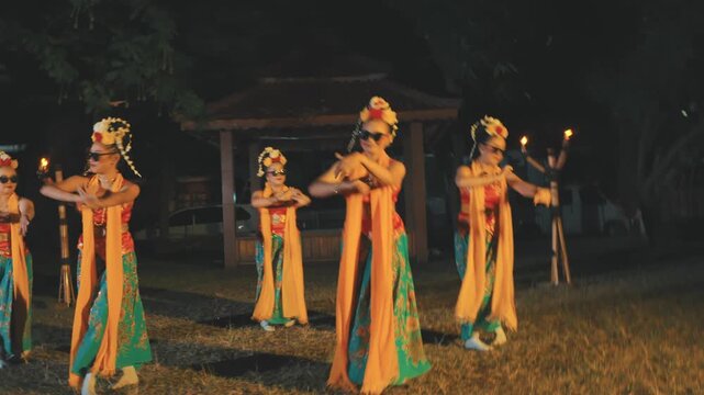 Group of Javanese Dancers with Sunglasses Performing Synchronized Dance at Night