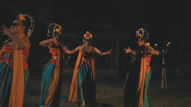Group of Javanese Dancers with Sunglasses Performing Synchronized Dance at Night