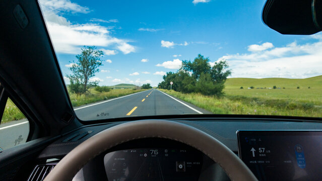First‑person driving perspective from driver&rsquo;s seat. Driving on Dada Line and Re&rsquo;a Line grassland highway, traveling through Inner Mongolia prairie natural landscape in daytime.