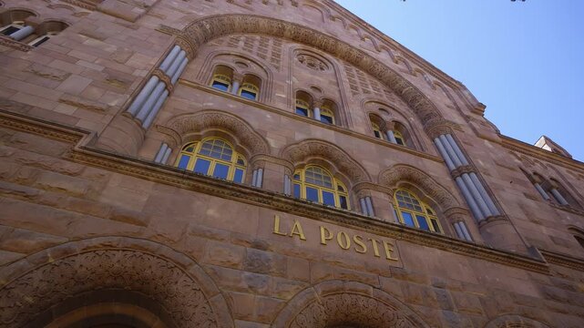 Low angle view of the historic La Poste building in Metz with its detailed stone architecture