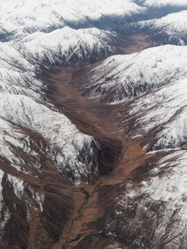 Aerial view of mountain ranges and valley.
