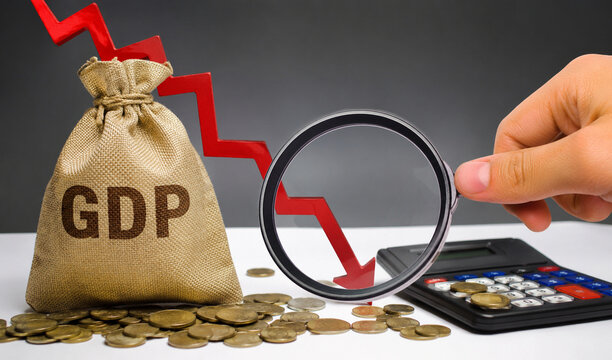 GDP Decline Concept with Falling Red Arrow, Money Bag, Coins, Calculator and Magnifying Glass for Recession and Economic Analysis
