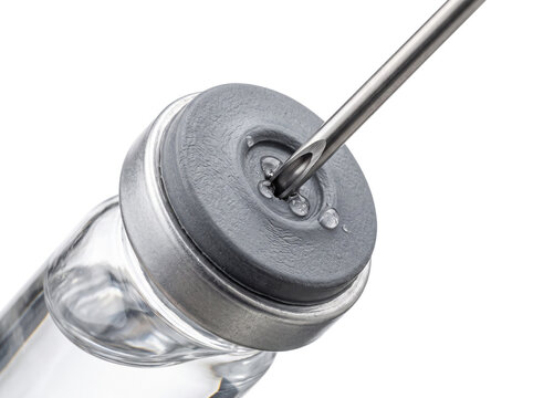 Medical vial needle syringe injection macro shot drawing vaccine liquid from glass bottle with rubber stopper concept for healthcare immunization treatment pharmacology research medicine on black back