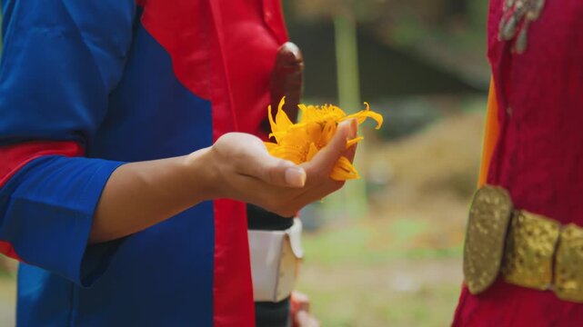 Javanese Dancer Holding Flower Prop in Traditional Costume
