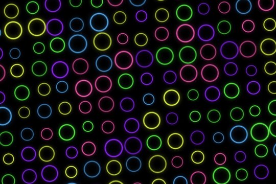 Colorful neon rings glowing on black background