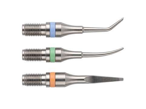 Dental ultrasonic scaler tips metal hygiene tools isolated on white background for professional dentistry teeth cleaning equipment set with color coded bands for endodontic periodic treatment.