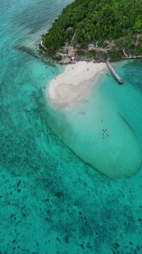Curved white sandbar in bright turquoise water near Oslob Cebu