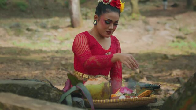 Mystical Dancer Preparing Ritual Offerings and Praying Outdoors