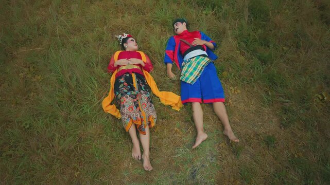 Overhead Close Up of Cultural Dancers Resting on the Ground