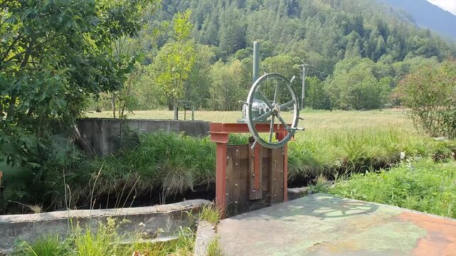 Mountain Landscape with River and Water Dam Diverter in Chialamberto Italy