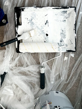 Redecorating, painting the walls with white emulsion