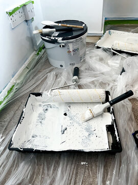 Redecorating, painting the walls with white emulsion