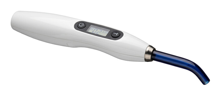 Dental curing light cordless device for tooth resin polymerizing in modern dentistry clinic with digital display and blue optical tip isolated on white background for professional oral care.