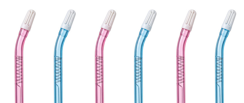 Dental suction tip aspirator tube plastic surgical saliva ejector medical equipment arranged in a row against black background for healthcare dentistry oral care hygiene concept background design.