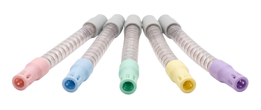 Dental saliva ejector suction tubes with colorful plastic tips arranged on black background for professional clinical dentistry, medical care, oral hygiene, and surgical health equipment.