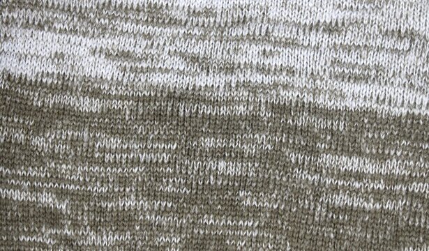Close up of marled knit fabric texture with soft focus during daylight