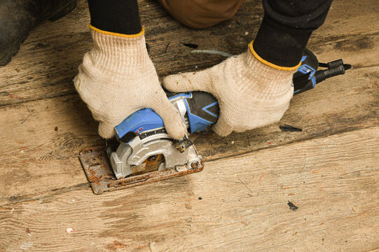 Close-up footage of a handheld circular saw cutting 
